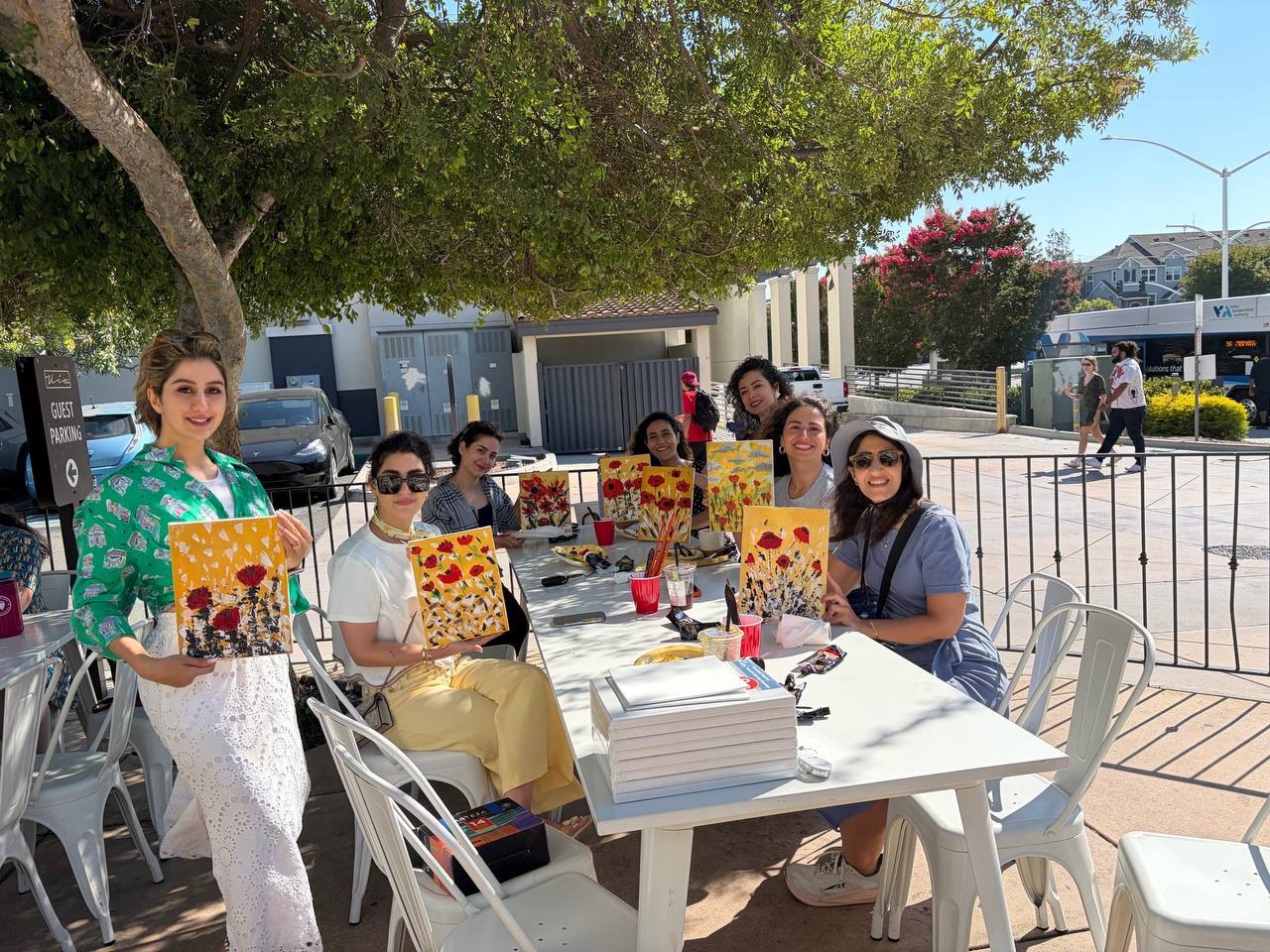 Participants sharing their colorful floral paintings